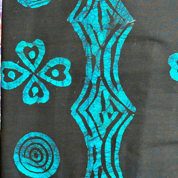 The African Fabric Wax Batik #2022 features teal abstract patterns on a dark background with geometric shapes like hearts, swirls, and waves. Its colorfast design keeps the vivid motifs bright even after repeated use.
